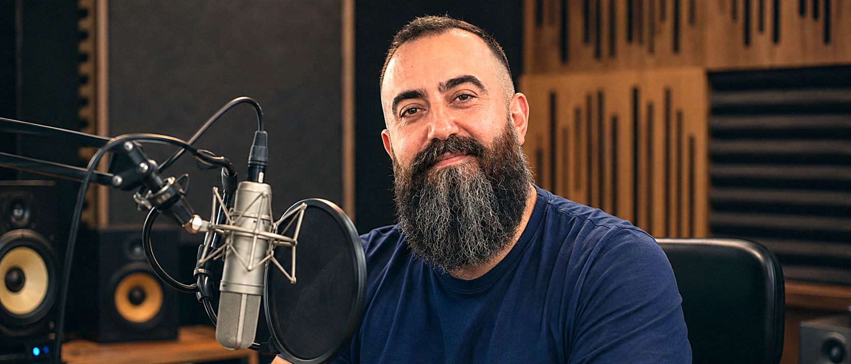 Vahik M. Lee at the microphone in his studio